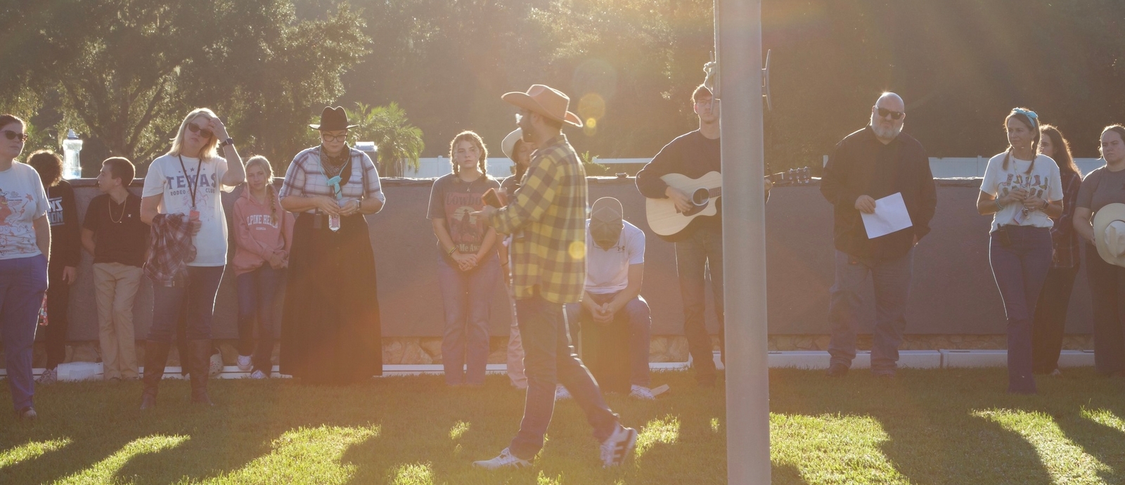 Child laughing in front of chalkboard